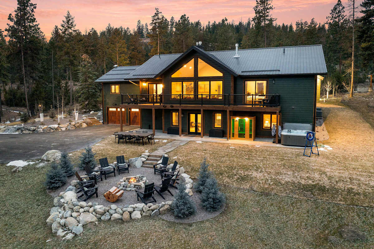 The Tamarack lodge exterior and fire pit at sunset