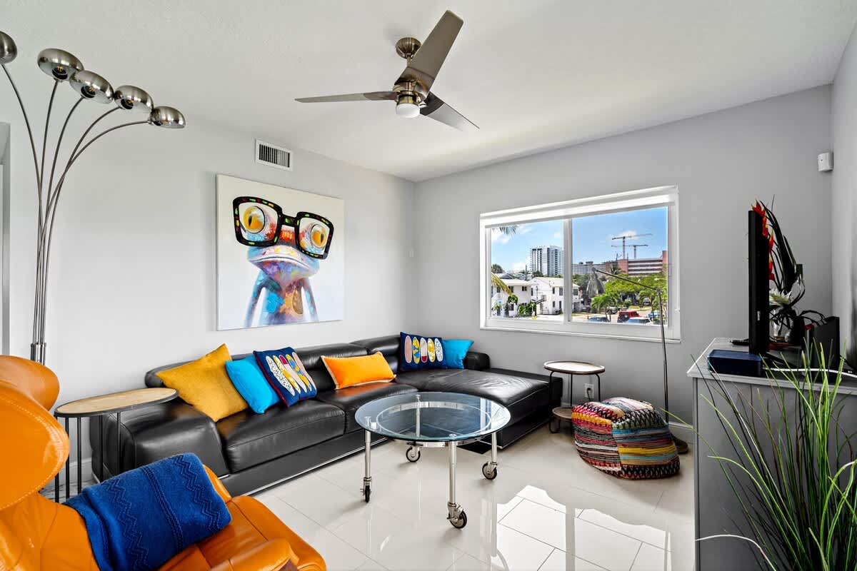 Pompano Condo: Pops of color give the space a fun and playful vibe