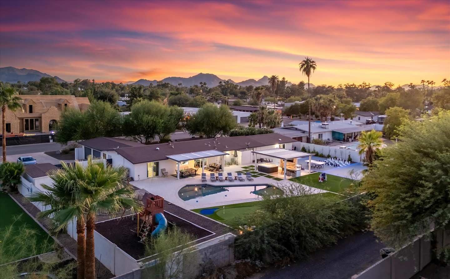 Wide aerial sunset view of North Scottsdale and distant mountains