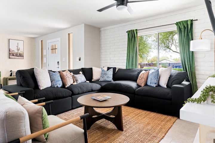 Living room with sectional sofa and bright windows
