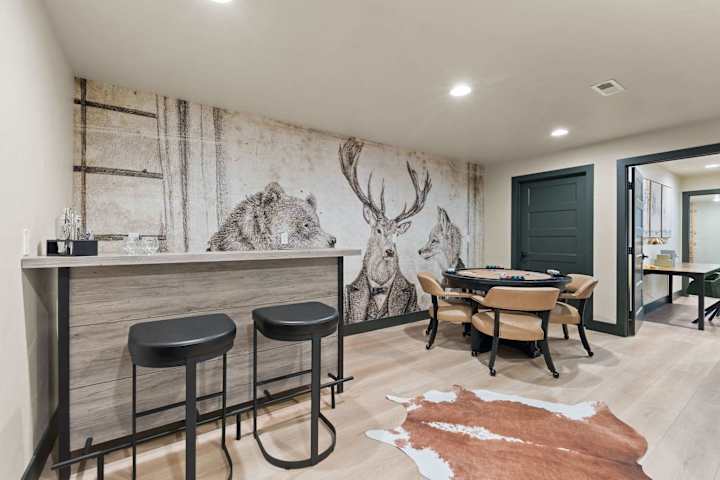 Dining nook with bench seating and mountain artwork