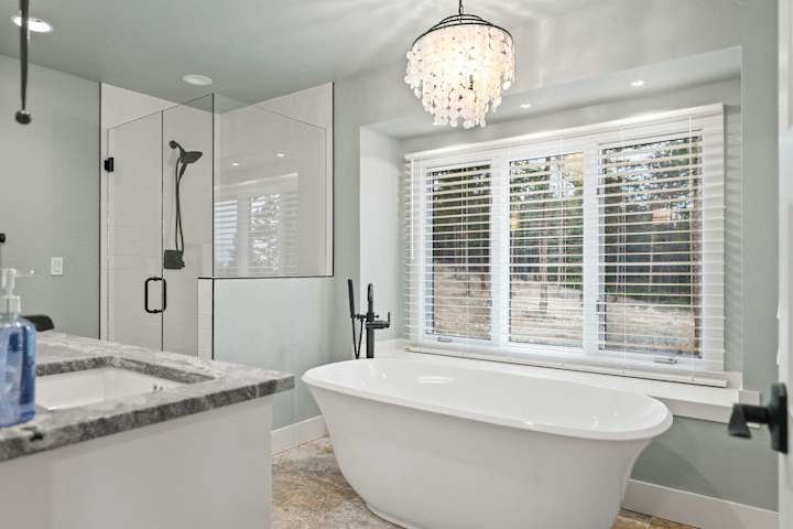 Glass shower and soaking tub in the primary bathroom
