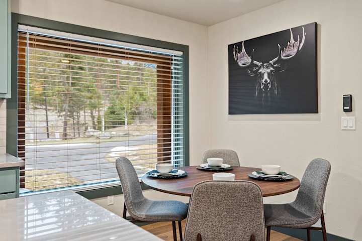 Breakfast table beside a large window