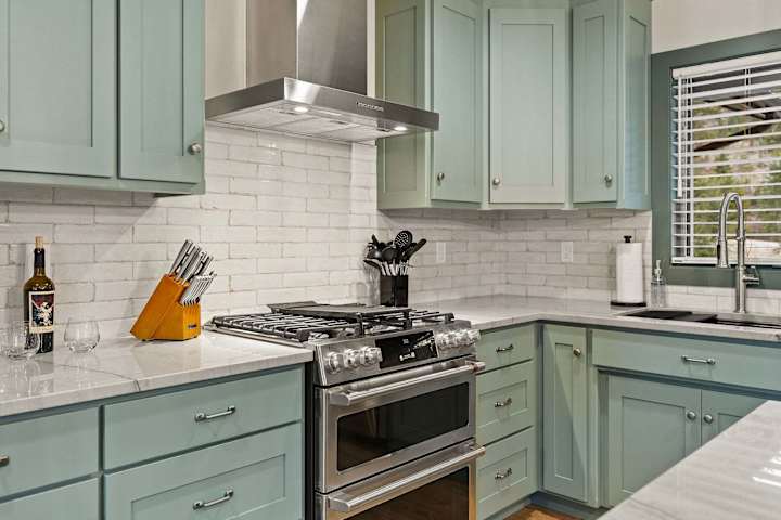 Kitchen range, tile backsplash and countertop workspace