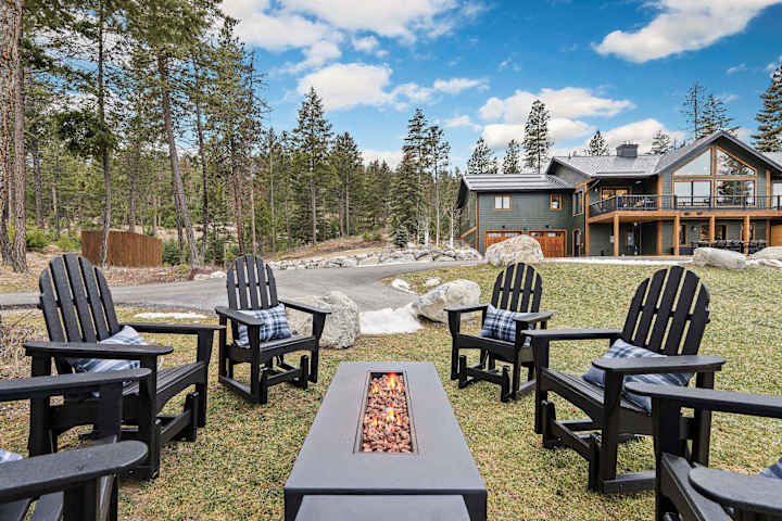 Fire pit circle and Adirondack seating in the backyard