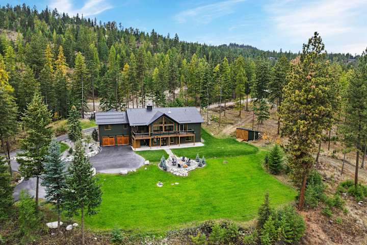 Aerial view of the lodge, lawn and fire pit