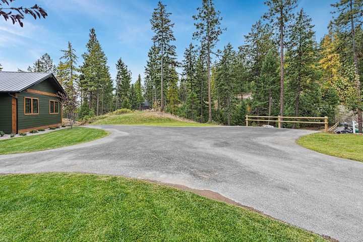 Driveway winding through the trees toward the house