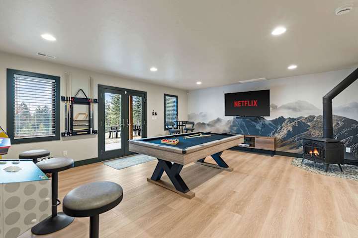 Game room with pool table and arcade games