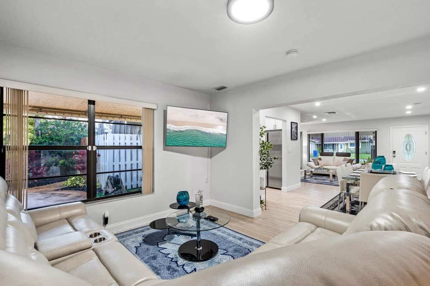Gardens By The Sea: Living room with sectional seating, smart TV and garden views