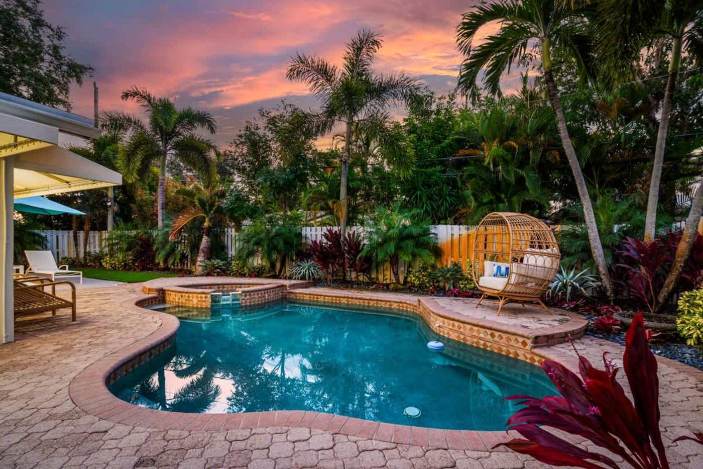 Gardens By The Sea: Pool and spa at dusk, with palms and tropical planting