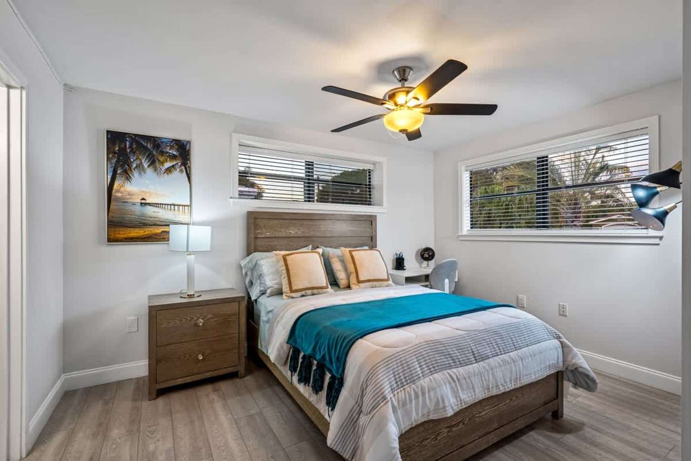 Gardens By The Sea: Bedroom with queen bed, ceiling fan and bedside table