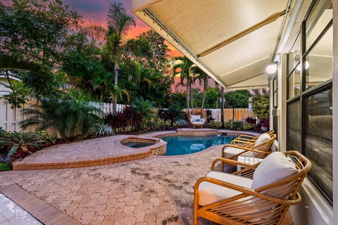 Gardens By The Sea: Pool and spa seen from the patio at sunset