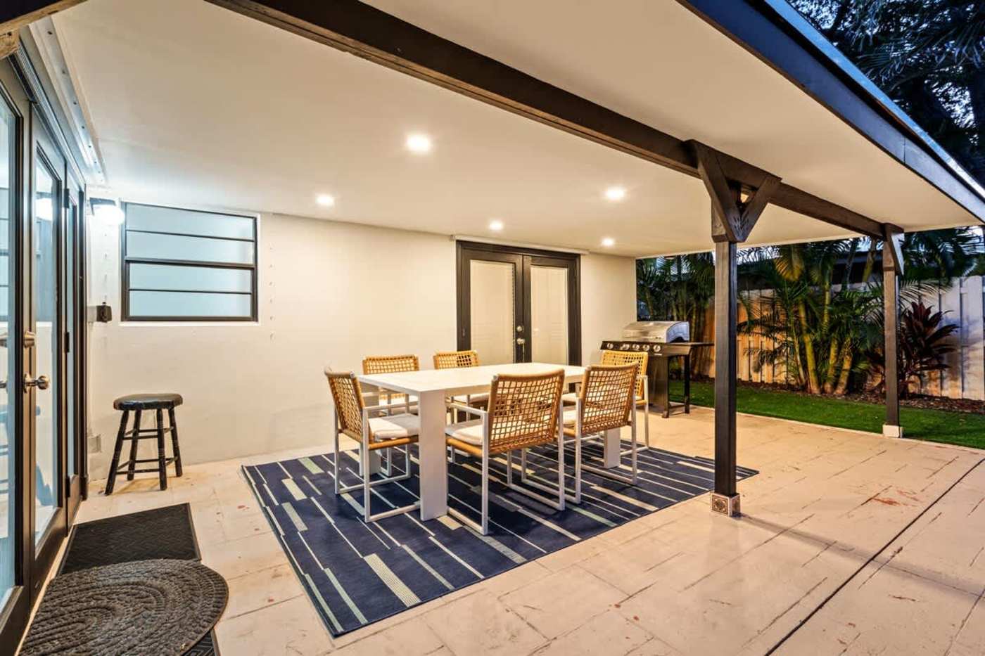 Gardens By The Sea: Covered patio with dining for six, opening to the lawn