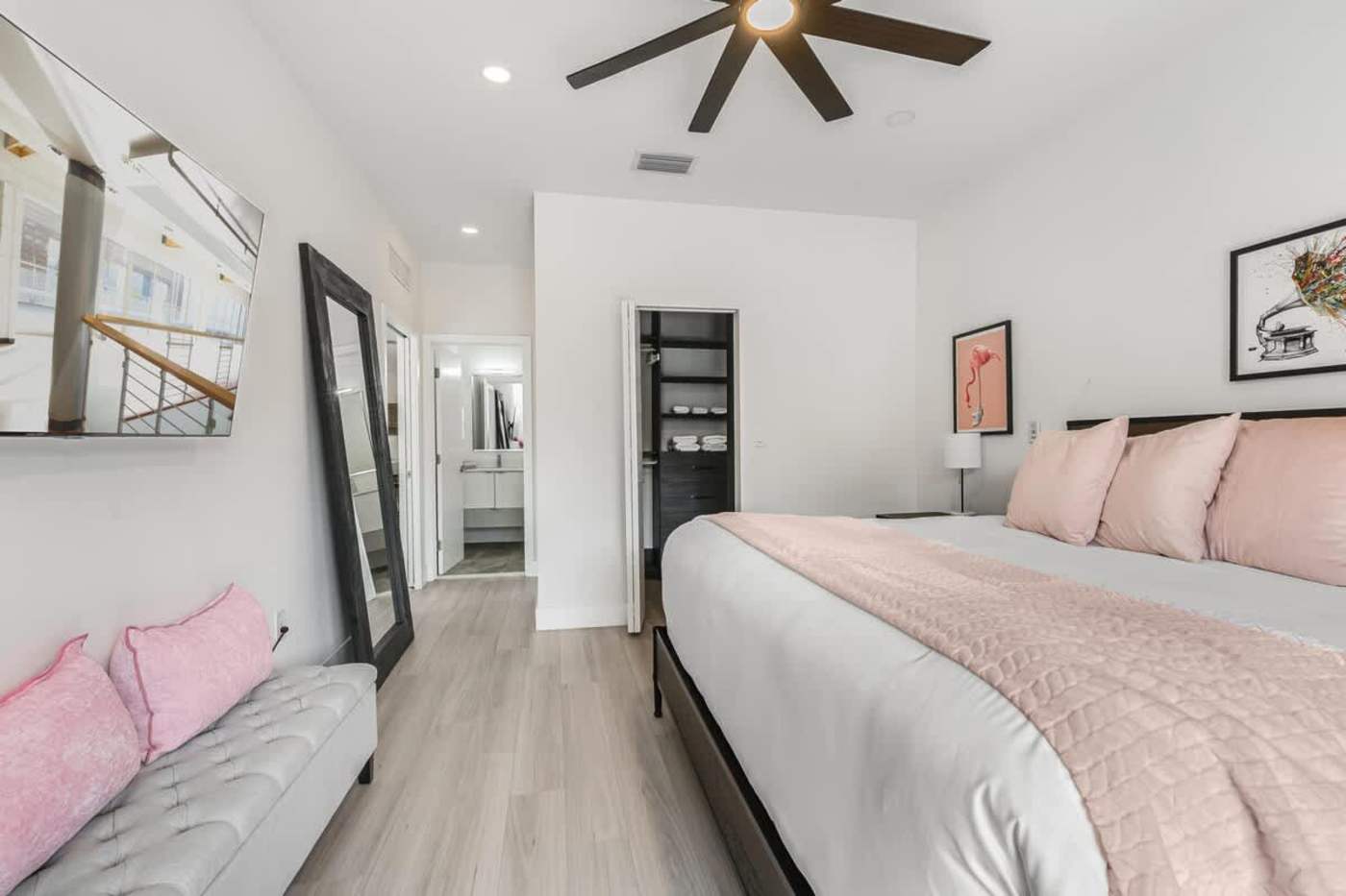 The Arcade House: Bedroom with king bed, sofa and fitted storage