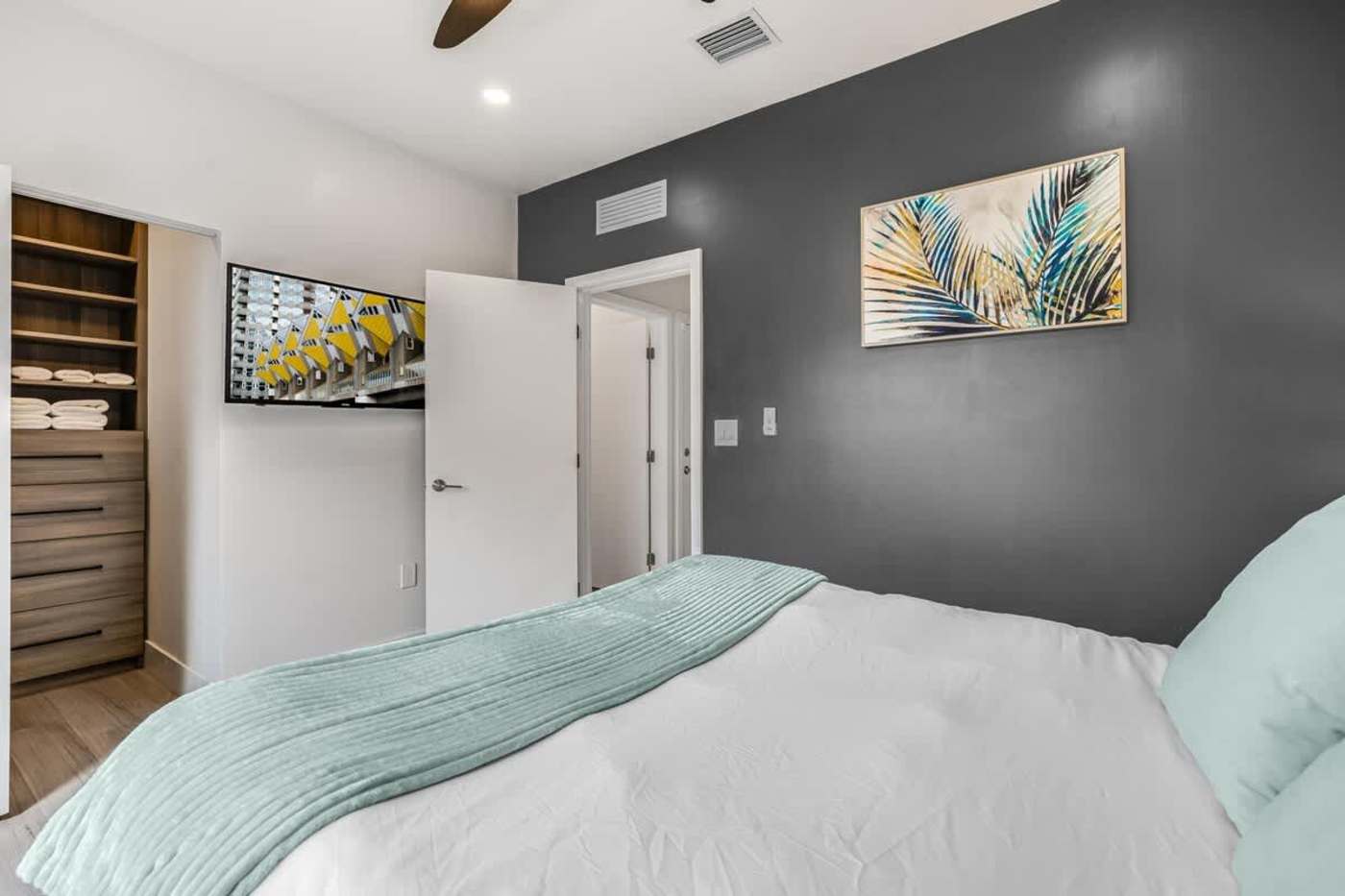 The Arcade House: Bedroom with king bed, walk in wardrobe and dressing area