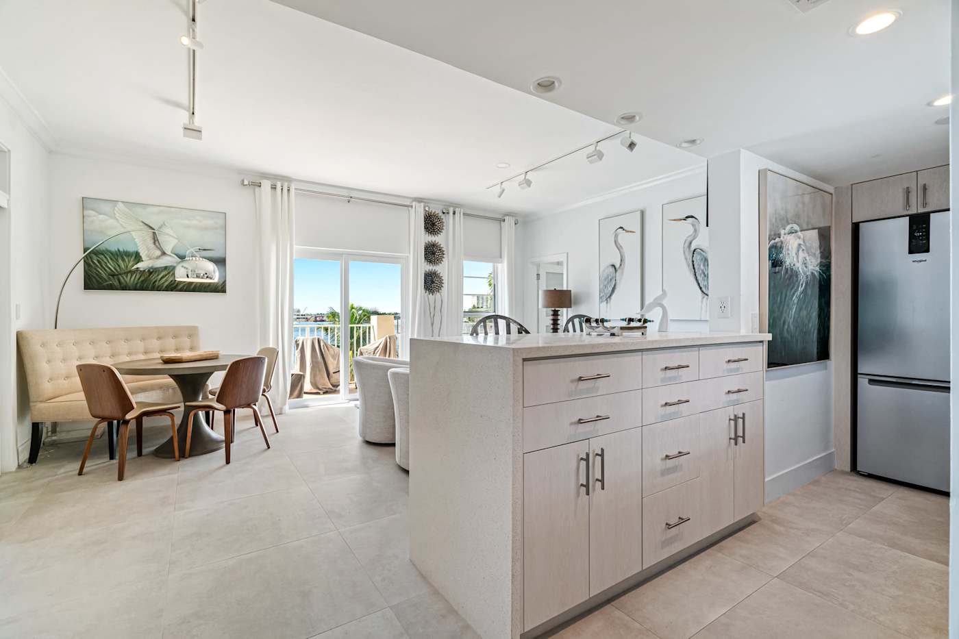 Ocean Block: The kitchen island looks out over the dining and living areas