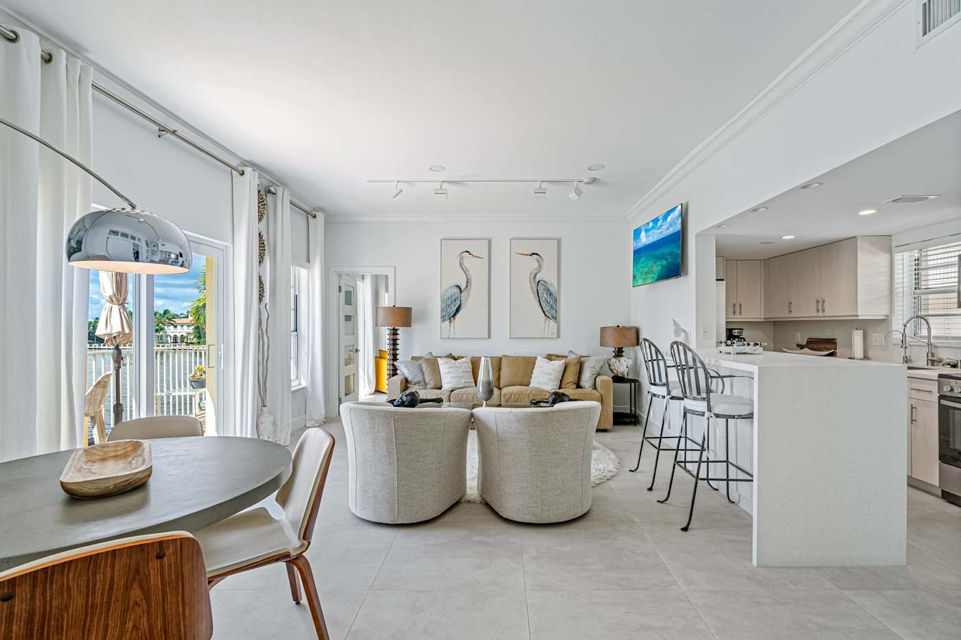 Ocean Block: The open layout joins the dining table, living room and kitchen bar