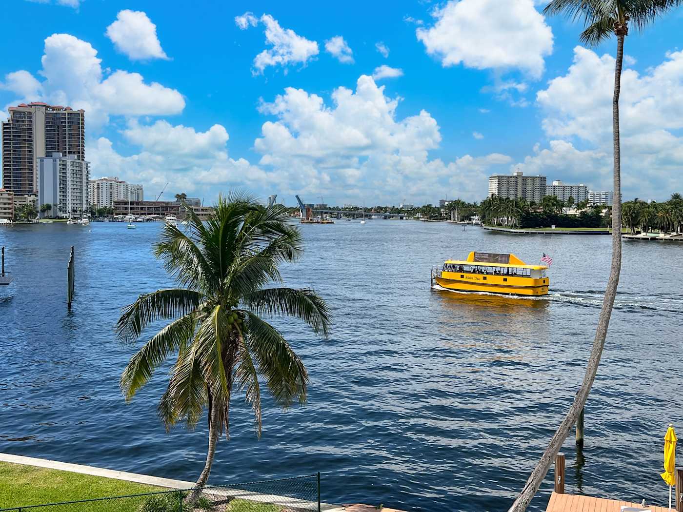 Ocean Block: A water taxi passes by on the water in front of the building