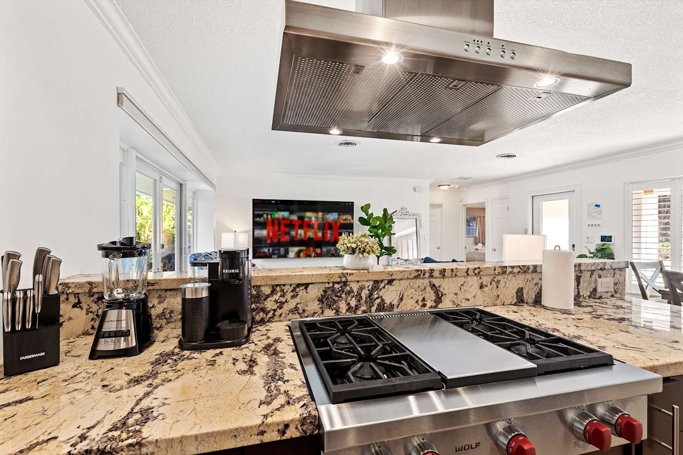 Cypress Cove: The kitchen has a gas cooktop with a griddle and a coffee maker