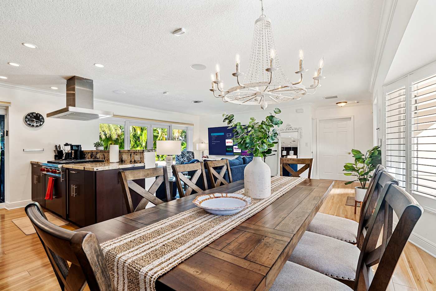 Cypress Cove: The dining table sits between the kitchen and the living room