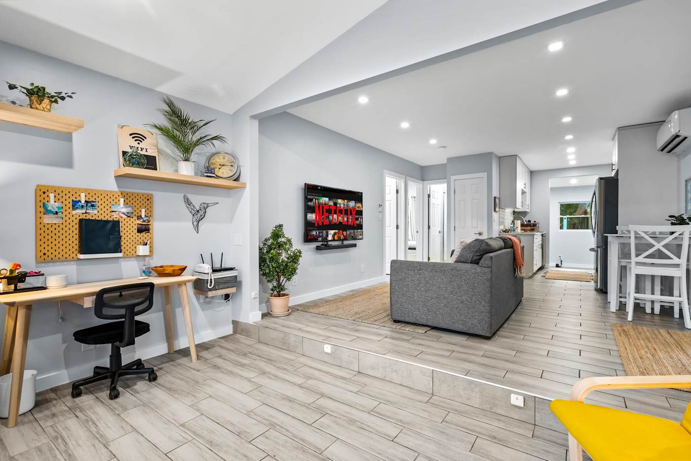 EV Retreat: A desk with an office chair sits just off the living room