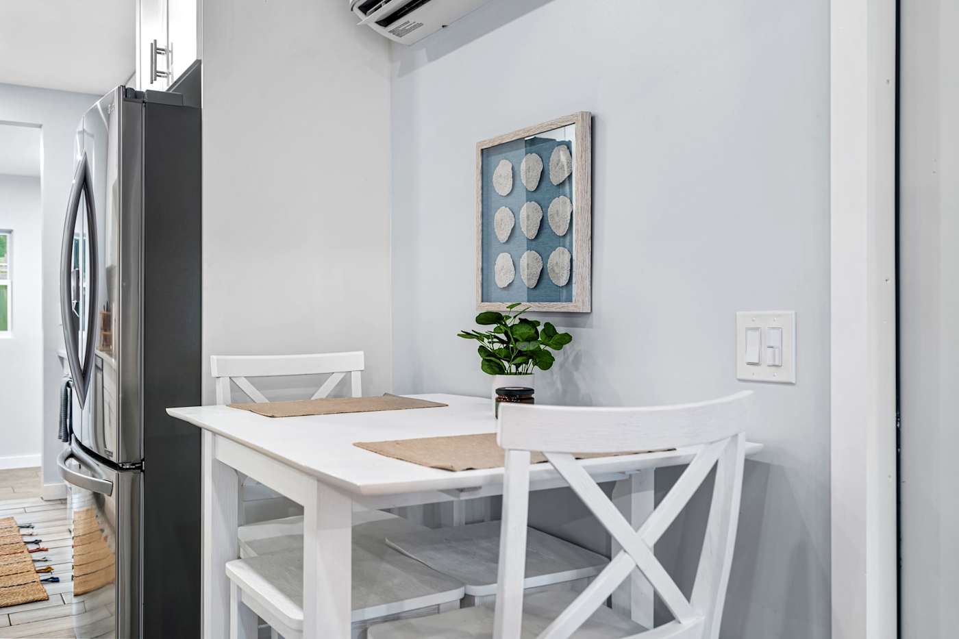 EV Retreat: A small dining table for two sits beside the kitchen