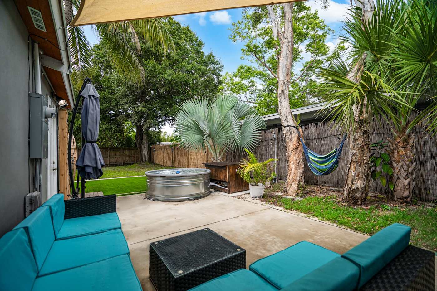 EV Retreat: The back patio has an outdoor sectional, a hammock and a cold plunge tub