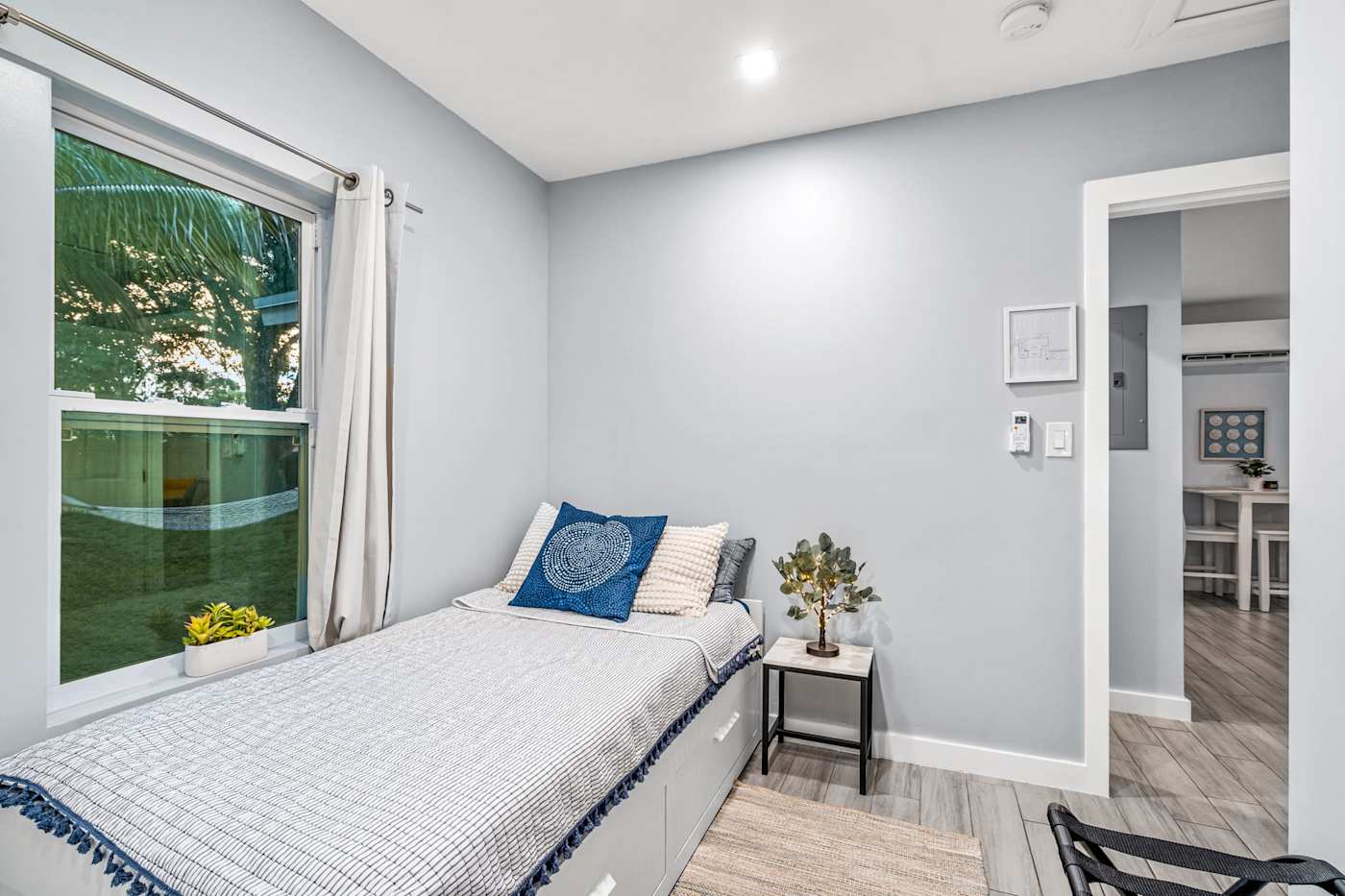 EV Retreat: This bedroom has a bed with storage drawers and a window