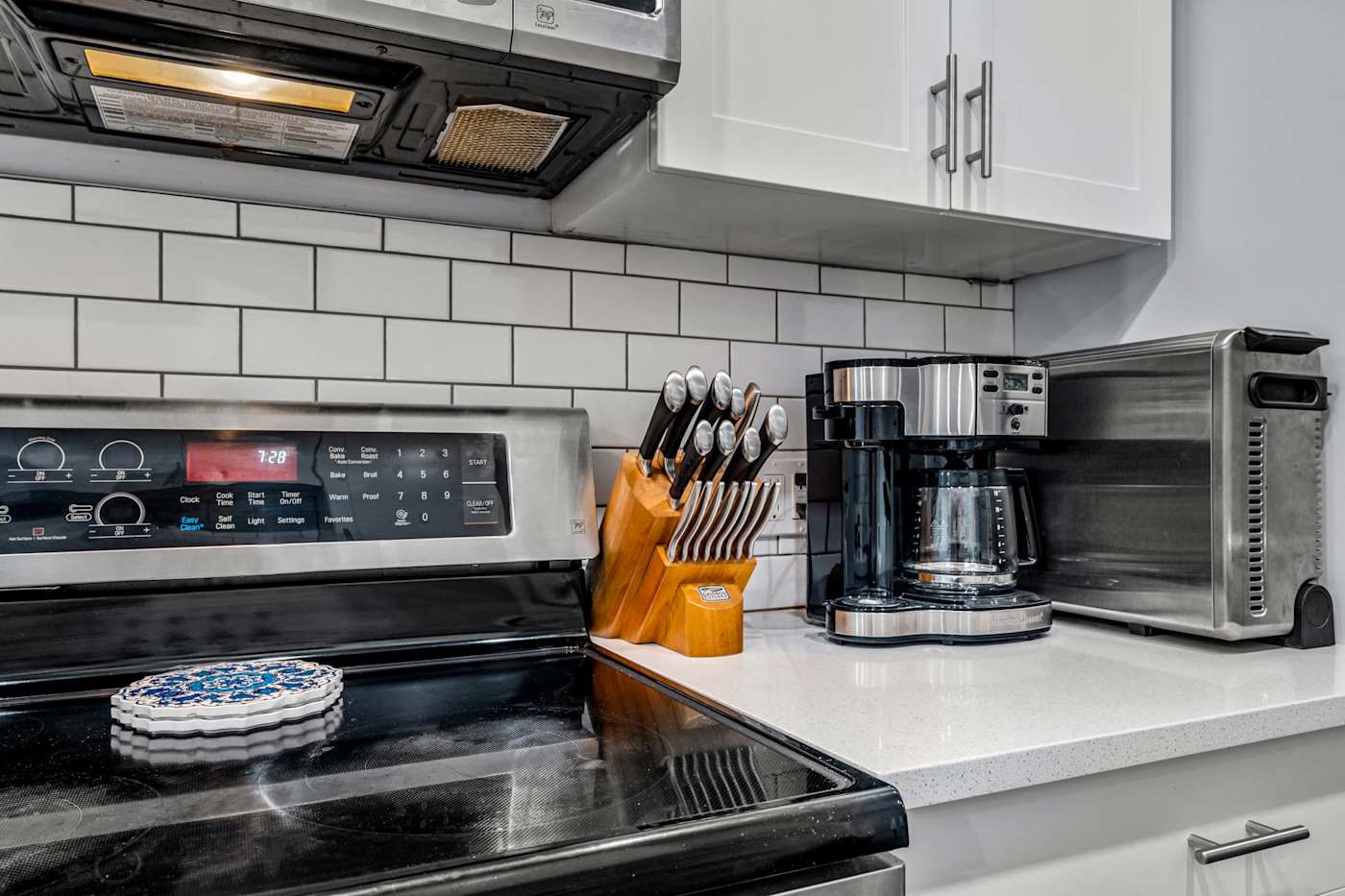 EV Retreat: A coffee maker and toaster oven sit next to the stove