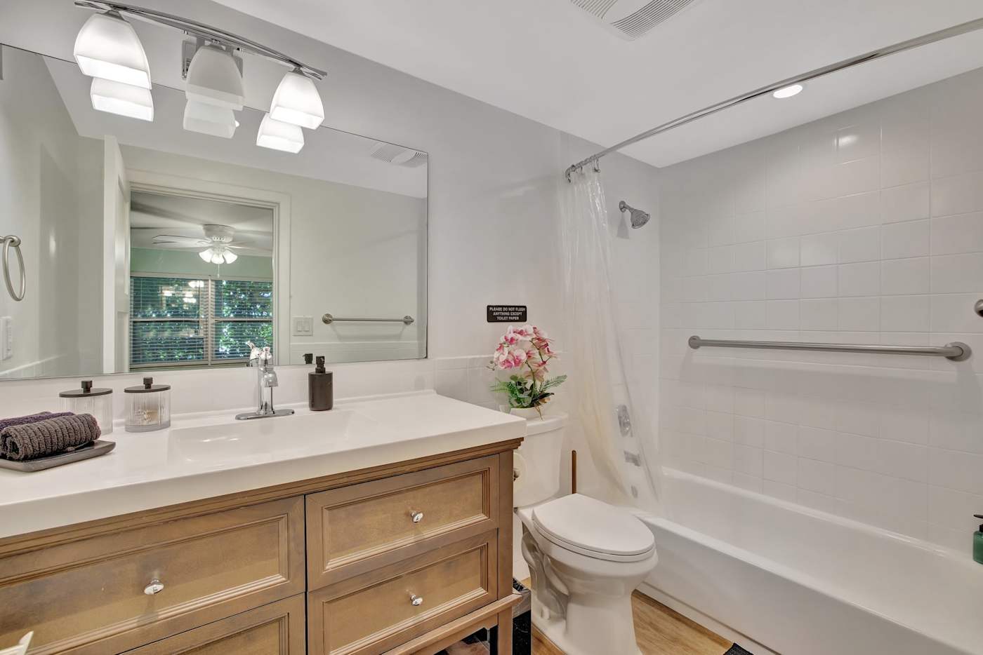6 Bed Beach House: Bathroom with bath, shower over and wood vanity