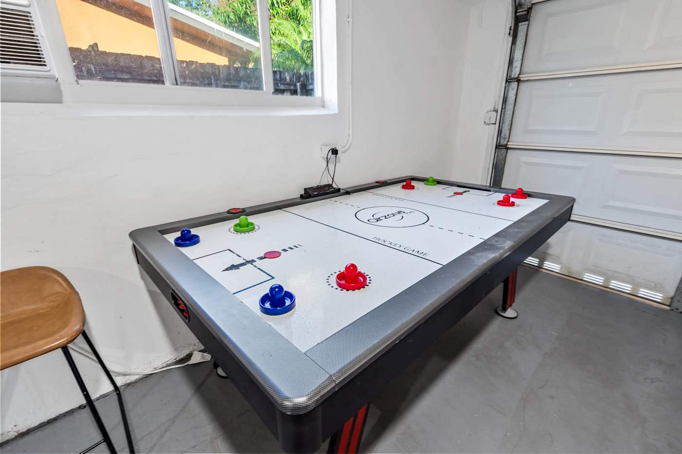 The Game House: Air hockey table in the games room