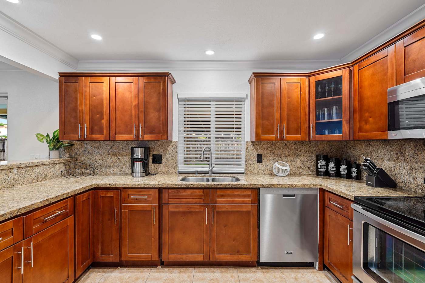 The Game House: Kitchen with granite counters, sink, dishwasher and coffee maker