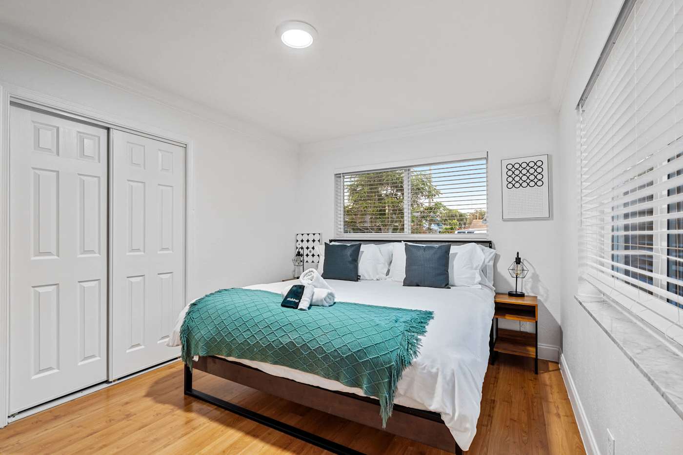 The Game House: Bedroom with king bed, wardrobe and bedside table