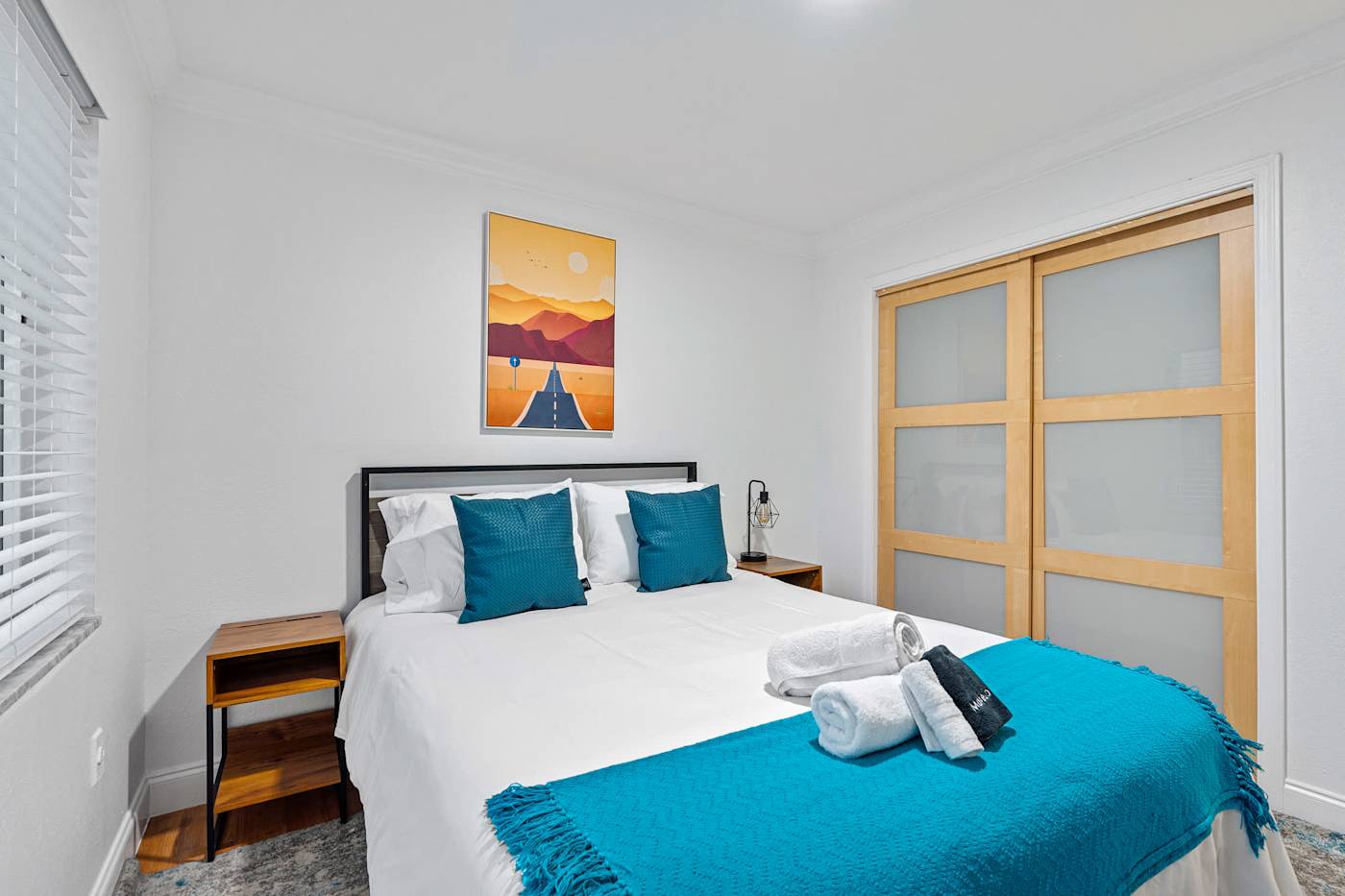 The Game House: Bedroom with king bed, bedside tables and fitted wardrobe