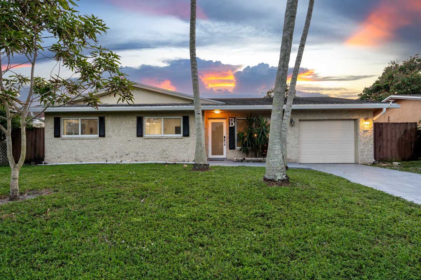 The Game House: The house from the lawn at sunset