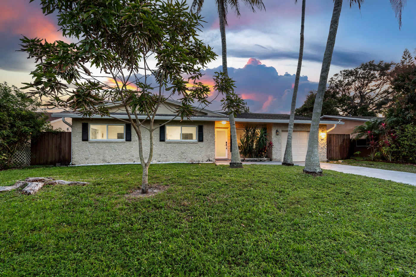The Game House: The house and front garden at sunset