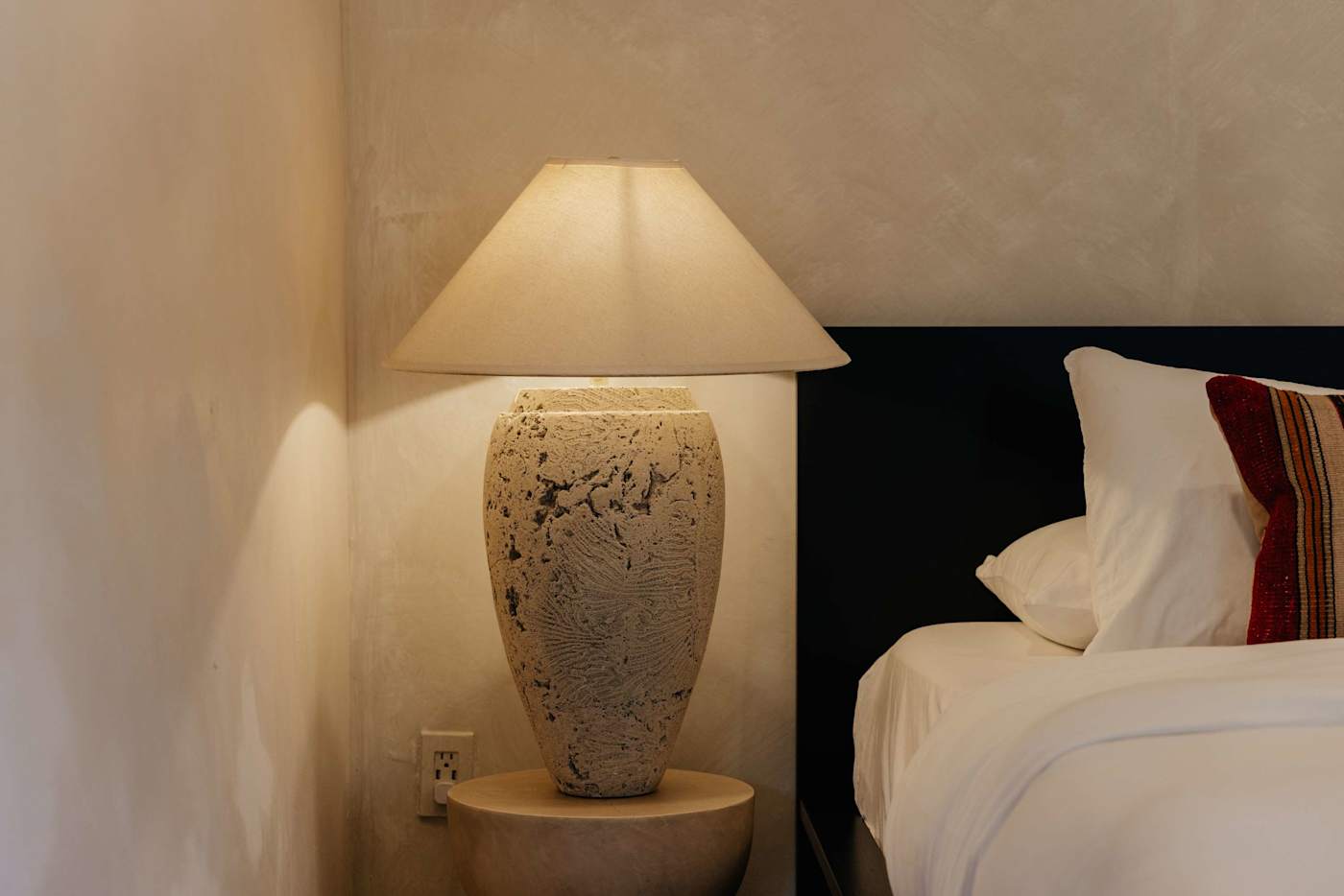 Sombra Cottage: Vintage lamp next to the queen bed