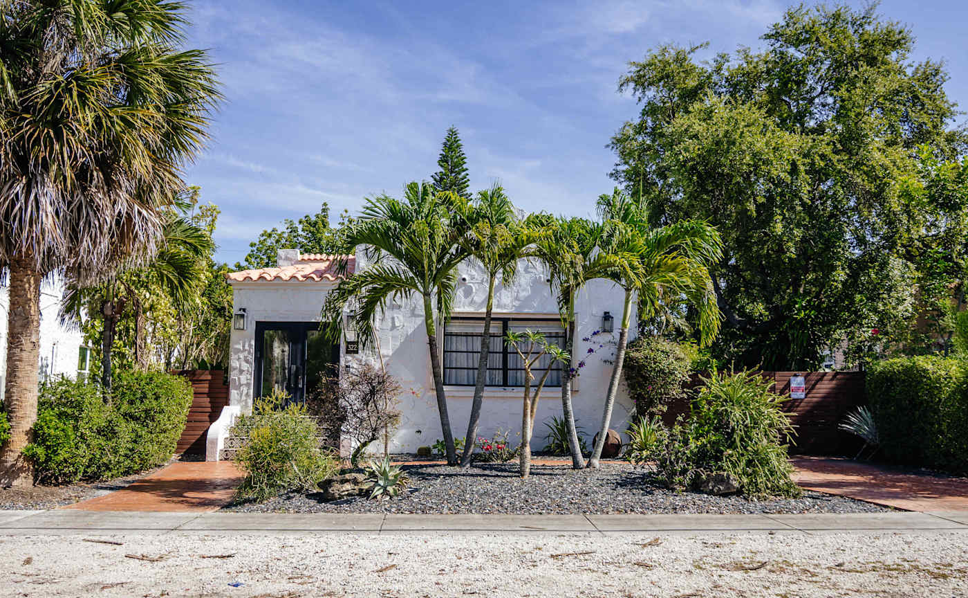 Sol y Sombra: View from the street showing the unique spanish style of the home