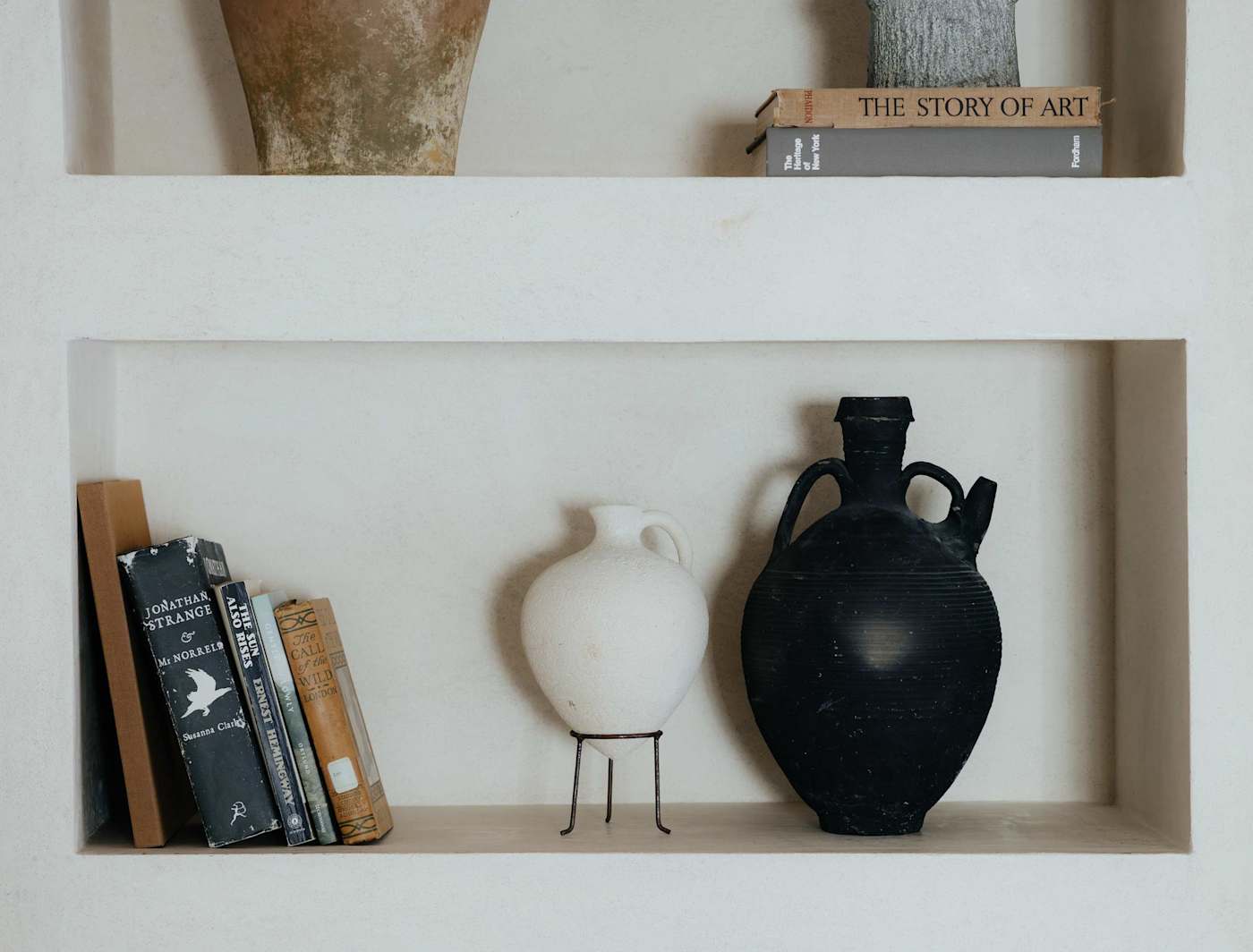 Sol y Sombra: Custom book shelf with vintage pottery, books and other miscellaneous items