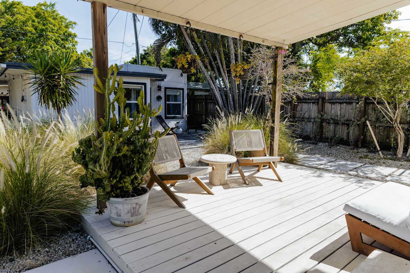 Sol y Sombra: Covered back patio area with seating for 4 and natural light