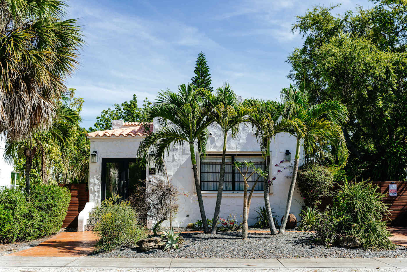 Sol y Sombra: Front view of the house with its luscious landscaping creating the perfect getaway