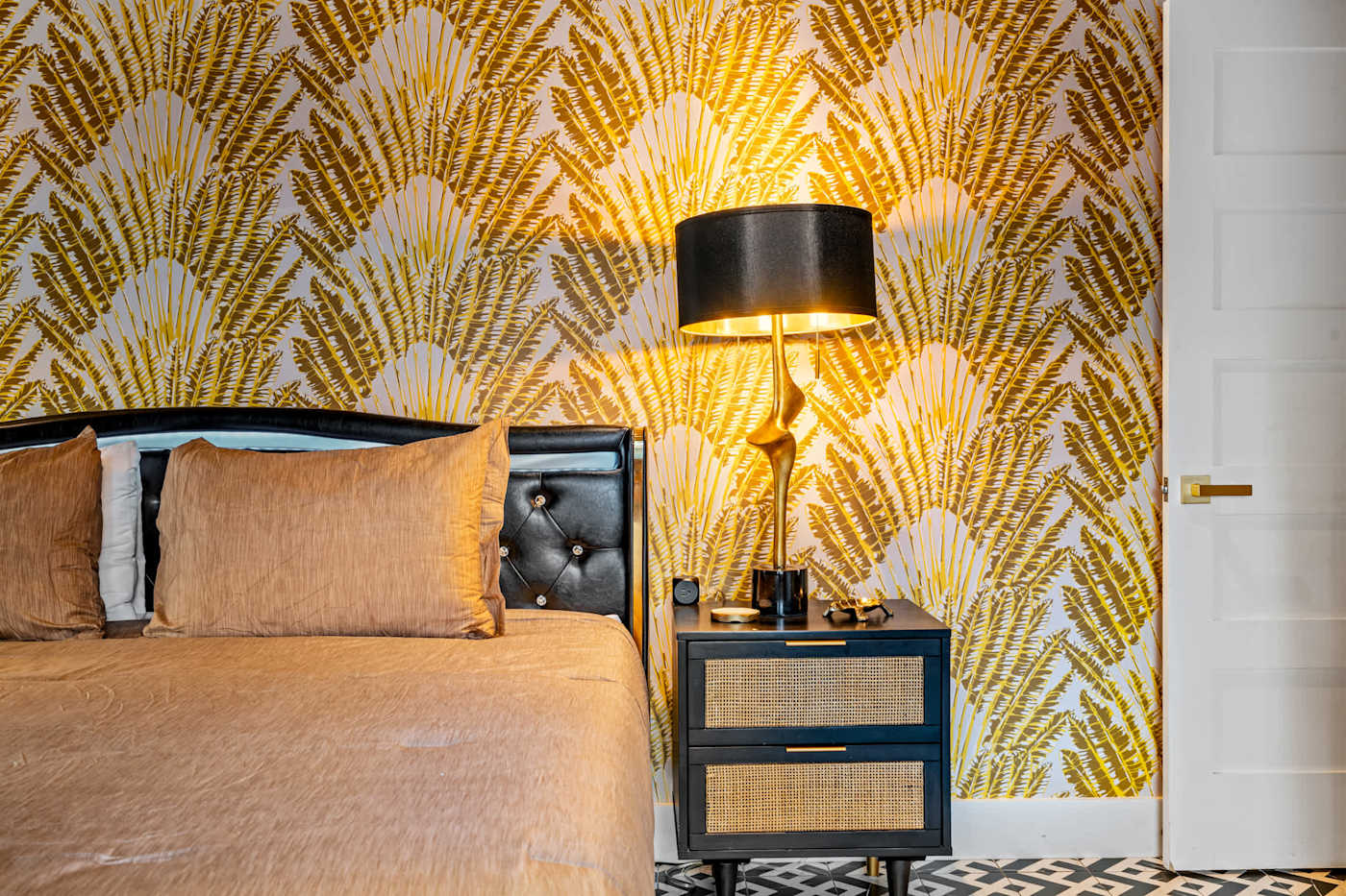 Beach Pop House: Bedside detail in the gold papered king bedroom