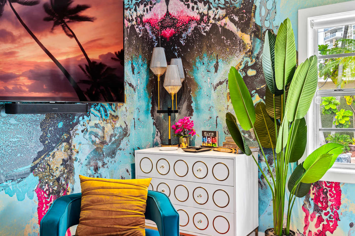 Beach Pop House: Seating corner with original art and tropical planting outside