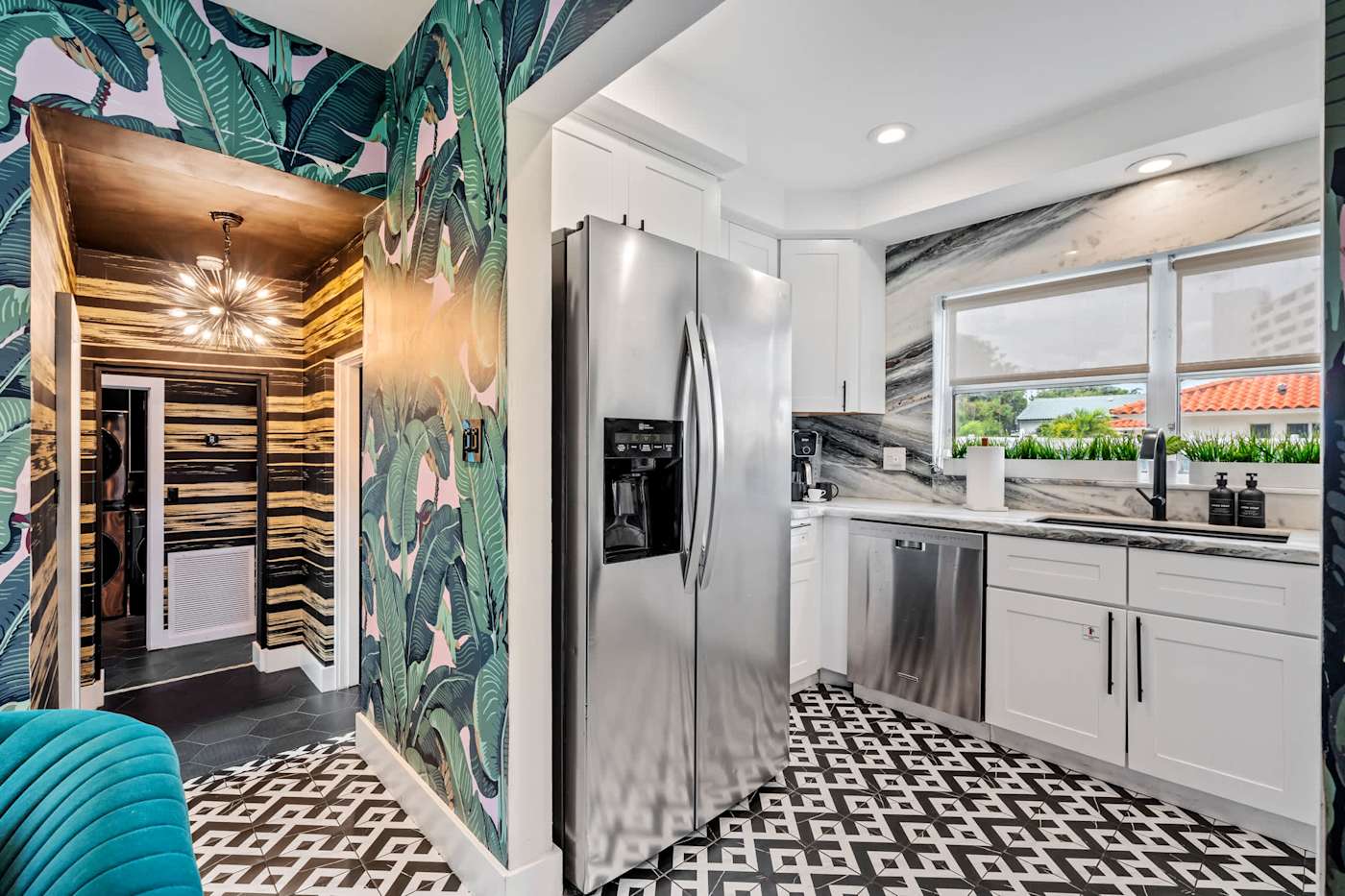 Beach Pop House: Kitchen and hallway, with tropical papered walls