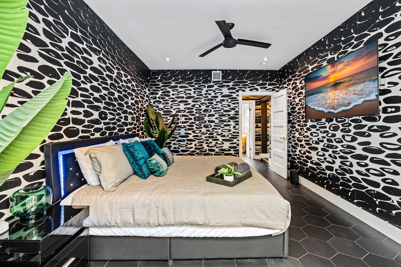 Beach Pop House: Bedroom with patterned wall and fresh linens