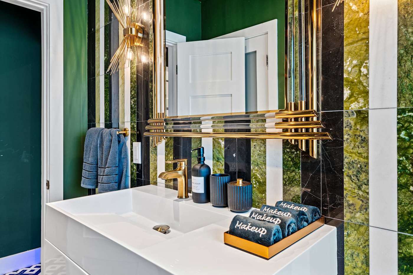 Beach Pop House: Bathroom vanity with gold fittings and toiletries provided