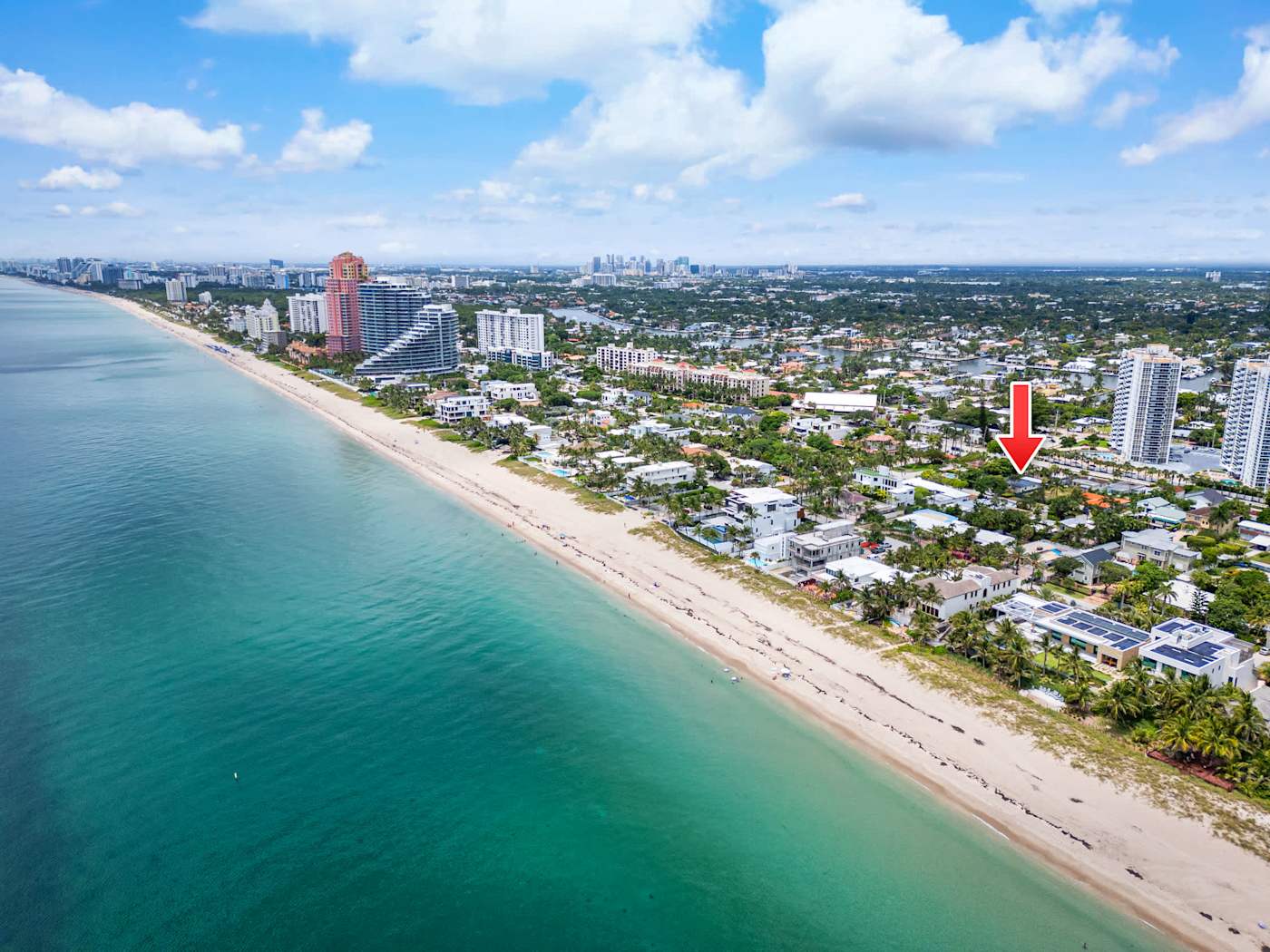 Beach Pop House: Aerial along the beach, with the house a short walk away
