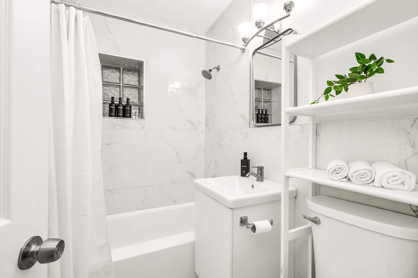 The Fairway: Bathroom with bath, shower over, vanity and shelved towels