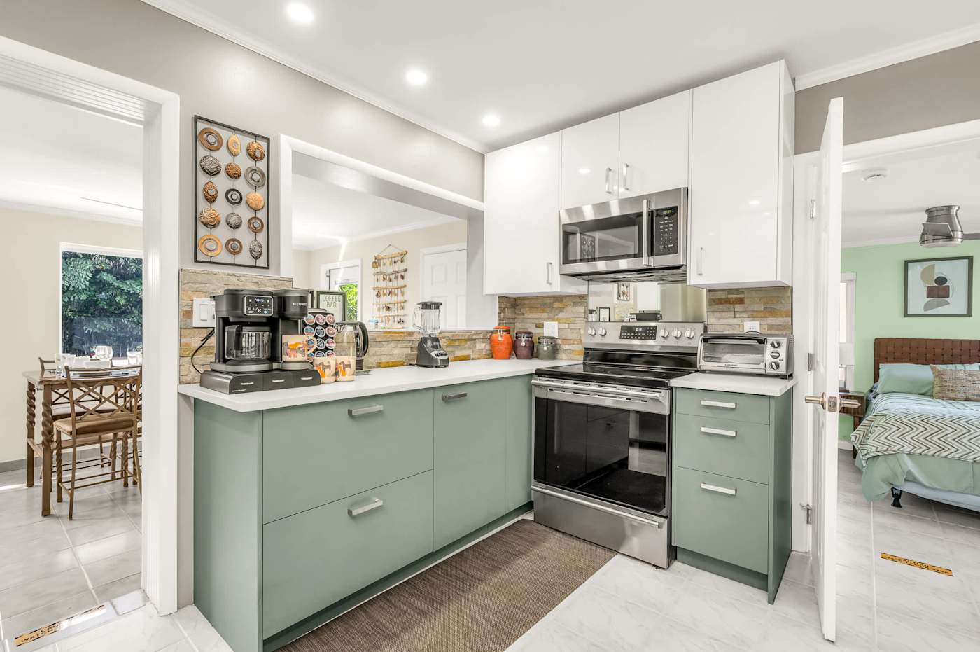 The Fairway: Kitchen with electric range, microwave and coffee maker