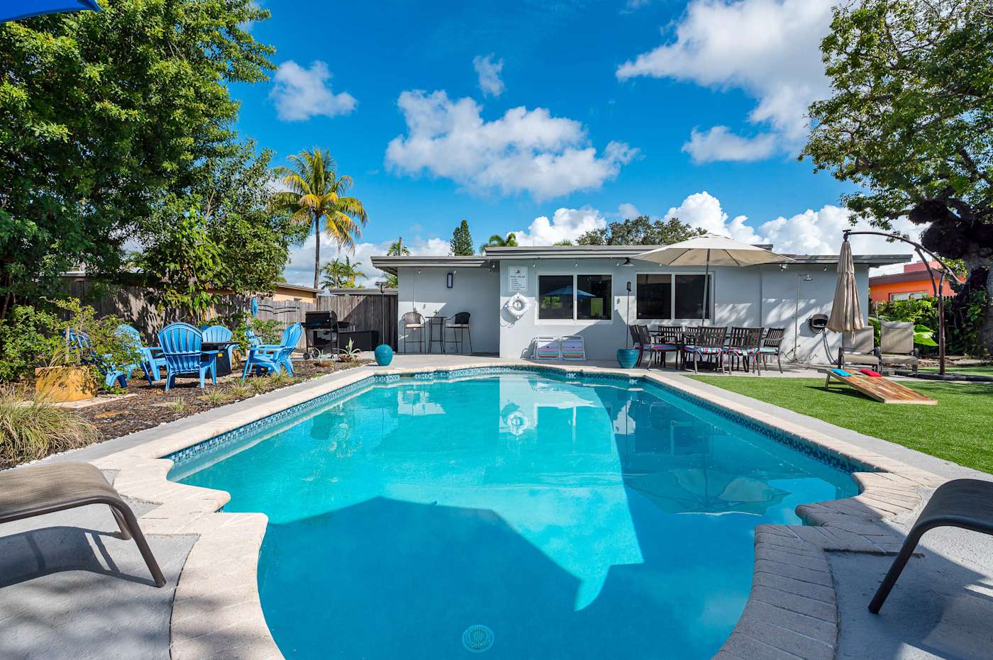 The Fairway: Heated pool and putting green, with the house behind